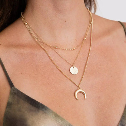 Golden Crescent & Starburst Triple-Layered Necklace